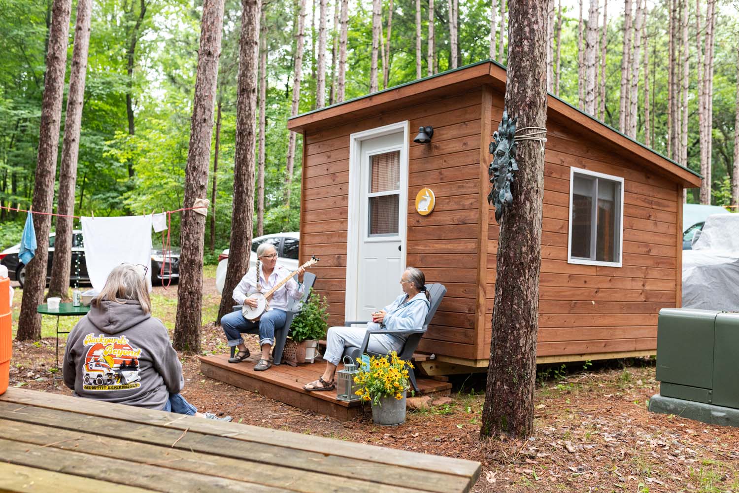 small cabin with people on porch